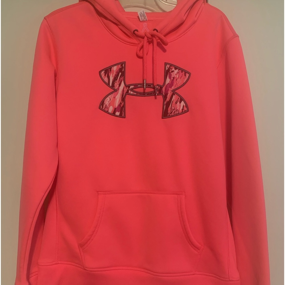 Highlighter pink with camouflage H on chest.